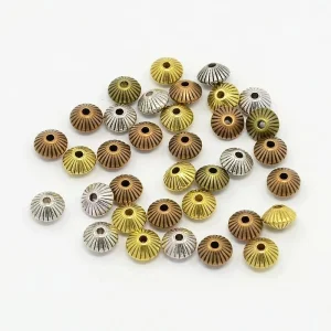 Metal alloy corrugated bicone spacer beads